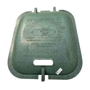 A heavy-duty cast iron gas tank lid with a textured greenish-bronze patina, featuring a central handle cutout and embossed safety and manufacturer text, shown against a plain white background.